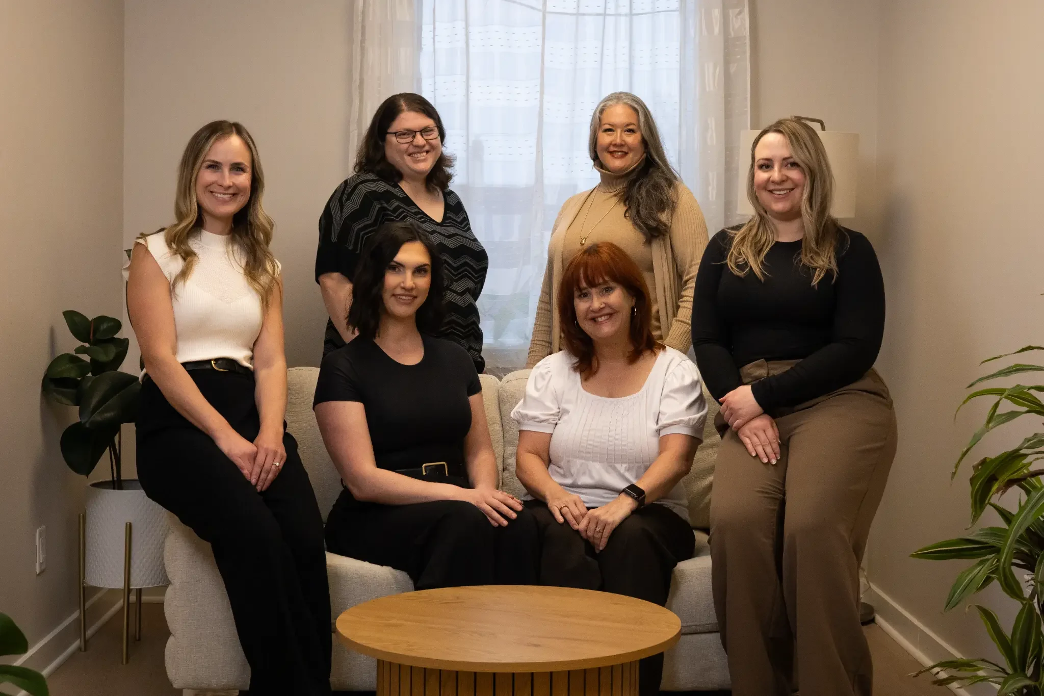 The Better Minds Counselling clinical team gathered together in their warm London, Ontario office
